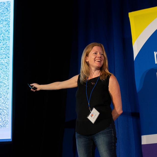 Festival Presenter Holly Krieger presenting on stage - National Math Festival 2019