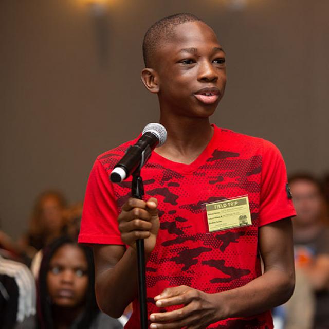 boy standing at microphone at 2019 festival