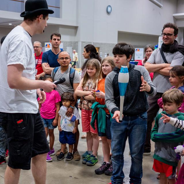2019 festival attendees watching a magician