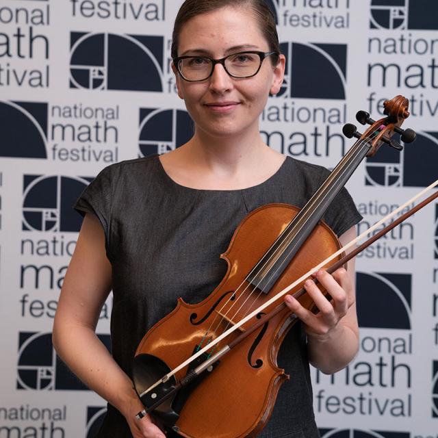 2019 Festival Presenter Lillian Pierce smiles for a picture while holding violin