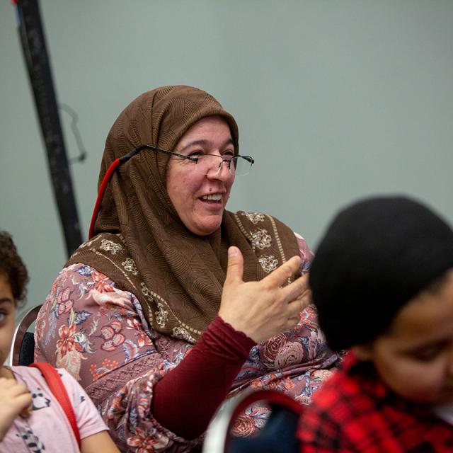 Amused woman in audience - National Math Festival 2019