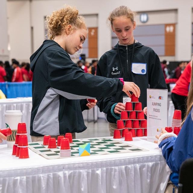 2019 Festival attendees playing cup games
